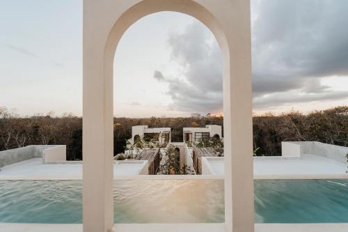 a view from the balcony of a house with a swimming pool at Villa Viento 4br 8pp Private Pool Rooftop Security in Tulum