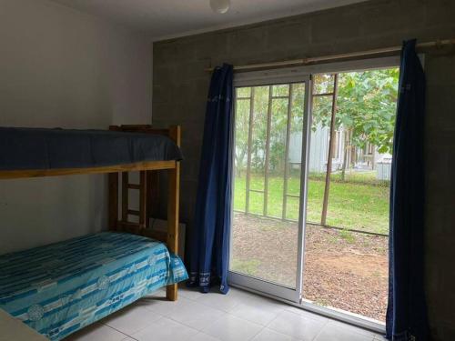 Ένα ή περισσότερα κρεβάτια σε δωμάτιο στο Casa Ingá
