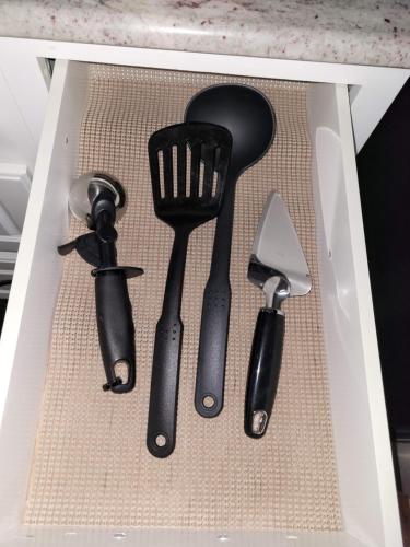 a group of kitchen utensils in a box at Big new house with huge parking in West Seneca