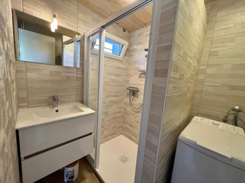 a small bathroom with a sink and a toilet at Gîte confortable à Gérardmer avec jardin, ski, randonnées et activités nautiques - FR-1-589-128 in Gérardmer