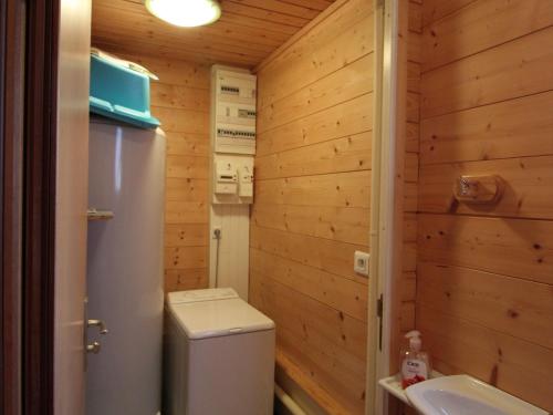 a small bathroom with a toilet and a sink at Chalet confortable à Cleurie avec WIFI, cheminée et terrasse - FR-1-589-71 in Cleurie