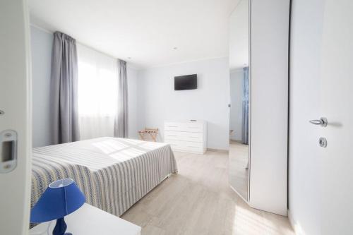 A bed or beds in a room at Home by Massi