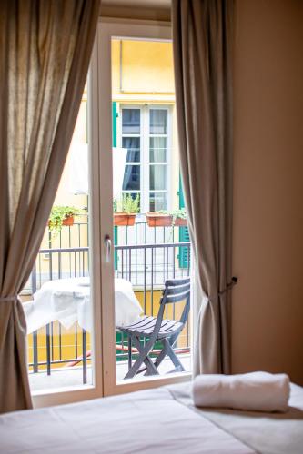 Postel nebo postele na pokoji v ubytování Hotel Novara