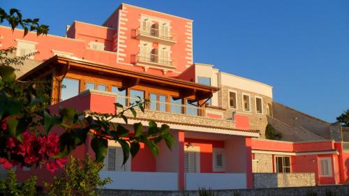a red and white building with a window at Hotel Boutique Il Castellino Relais in Vieste