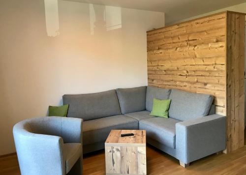 a living room with a couch and a table at Ferienwohnung Neubau in Alpbach