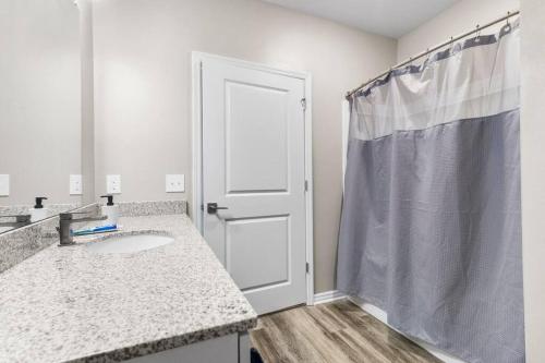 a bathroom with a sink and a shower at Contemporary Haven with Modern Amenities in Melbourne