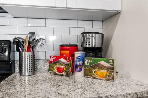 a kitchen counter with some food items on it at Contemporary Haven with Modern Amenities in Melbourne