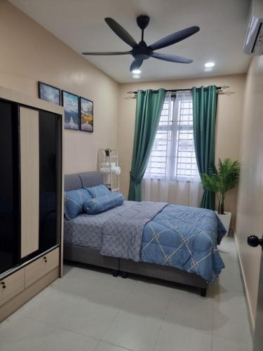 Katil atau katil-katil dalam bilik di Amazonite Homestay