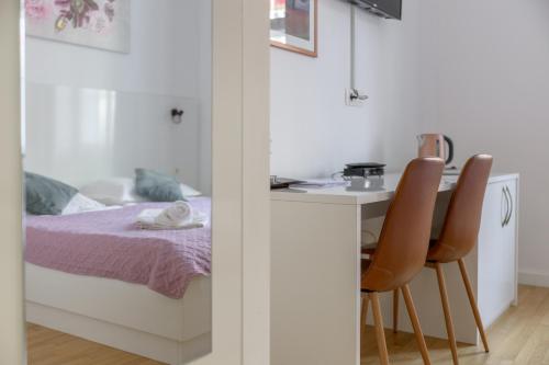 Katil atau katil-katil dalam bilik di Niva Rooms & Studio Apartment