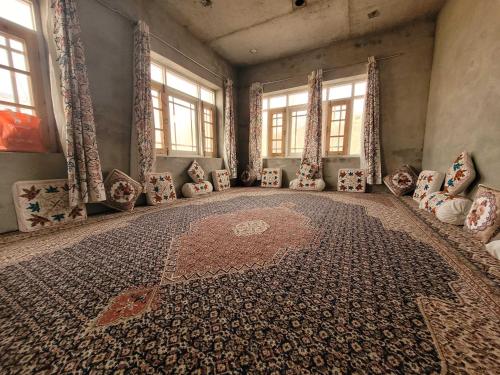 an empty room with a rug on the floor at POP Home Sharik Homestay 