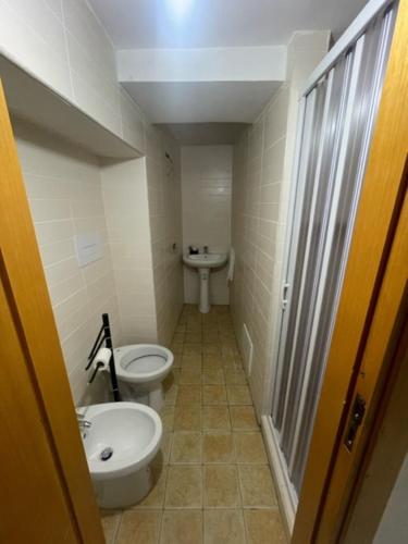 a small bathroom with a toilet and a sink at A Casa re nonn in Naples
