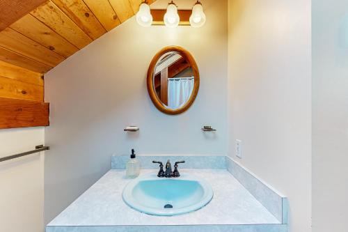 a bathroom with a sink and a mirror at Vineyard Vacation Cottage in Chilmark