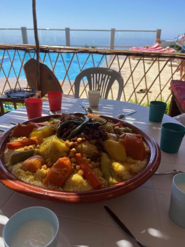 a plate of food on top of a table at Villa Le Pacha Assilah - Appartement in Asilah