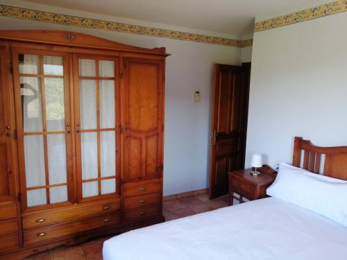 سرير أو أسرّة في غرفة في Casa la Nau