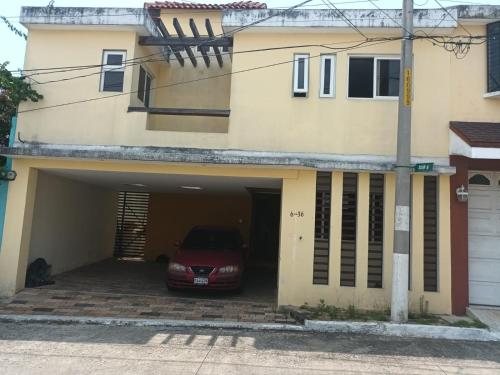 a car parked in the garage of a house at Villas de San Jose 3 in Mixco