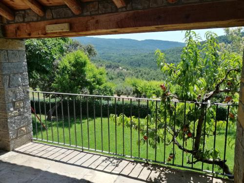 a balcony with a view of a green field at Casa la Nau in Huesca