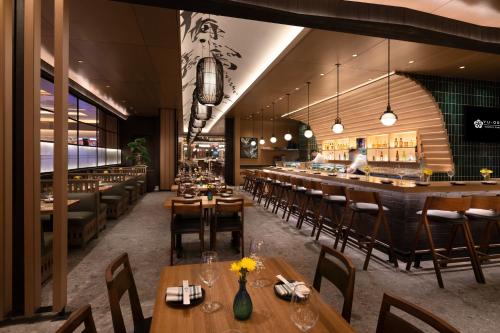 a restaurant with wooden tables and chairs and a bar at Durango Casino & Resort in Las Vegas