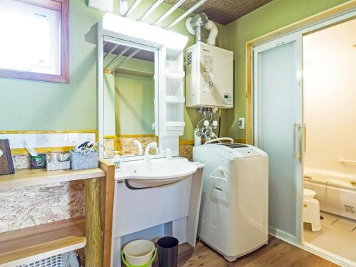 a bathroom with a sink and a washing machine at Country Cottage Waki Aiai - Vacation STAY 26548v in Sorachi