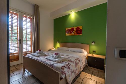 Postel nebo postele na pokoji v ubytování CapoSud - Appartamento Marina