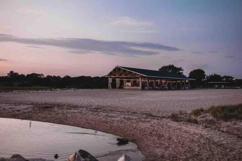 a building sitting on the side of a road at Spacious Oceanview Villa (Sleeps 22) in New London
