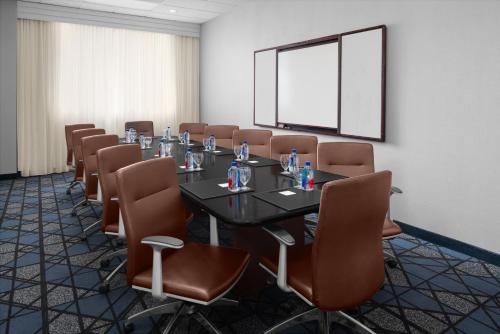 a conference room with a long table and chairs at Courtyard by Marriott Cypress Anaheim / Orange County in Cypress