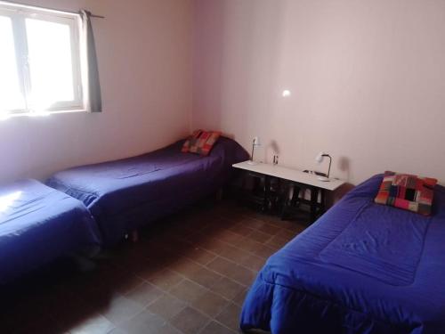 Кровать или кровати в номере Casa Ceramica Tilcara
