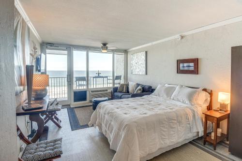 a bedroom with a bed and a view of the ocean at Daytona Beach Retreat Beach Access! in Daytona Beach