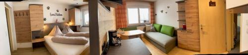a living room with a couch and a table at Haus Bergliebe in Schladming