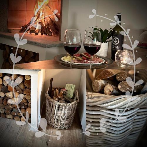 a table with two glasses of wine and baskets of bread at SopraBosco Calcata Art & Design Apartment in Calcata