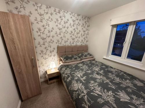 A bed or beds in a room at Entire Modern House in Staffordshire