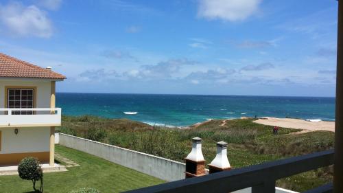 a view of the ocean from the balcony of a house at Casa do Baleal in Baleal