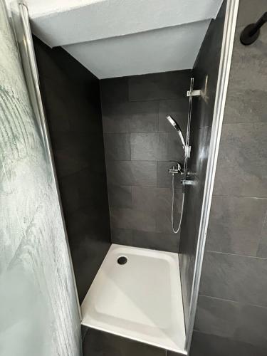 a shower stall in a bathroom with a toilet at SNOW NEST: Superbe cocon enneigé in Crans-Montana