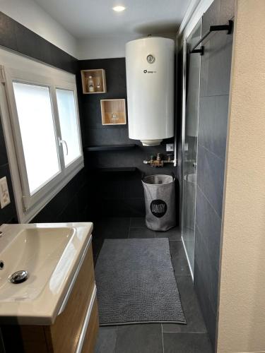 a bathroom with a sink and a shower at SNOW NEST: Superbe cocon enneigé in Crans-Montana