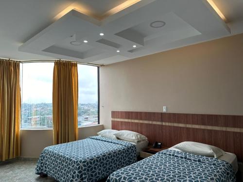 Postel nebo postele na pokoji v ubytování Hotel Torre Azul