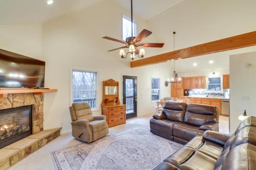 a living room with a couch and a fireplace at The Eagles Nest at Alpine Cabin with Fireplace! in Terra Alta