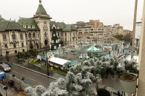 a view of a city with a street and buildings at Sweet cozy Ultracentral in Craiova