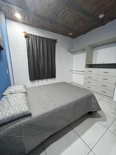 מיטה או מיטות בחדר ב-Departamentos colibri y tortuga