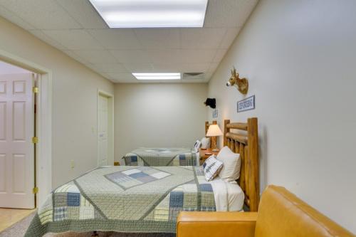 a hospital room with two beds and a chair at The Eagles Nest at Alpine Cabin with Fireplace! in Terra Alta