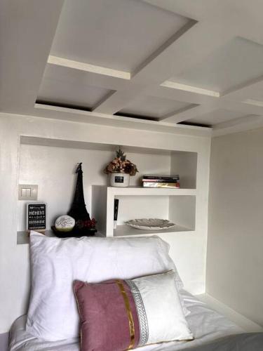 a room with a bed and a white ceiling at New & Spacious Unit in QC w/ Wifi & Netflix in Manila
