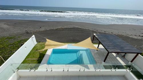 Utsikt över poolen vid Paracas House, Frente al Mar eller i närheten