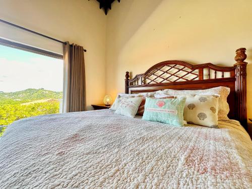 Postel nebo postele na pokoji v ubytování Villa 1208 @ Pristine Bay, Roatan