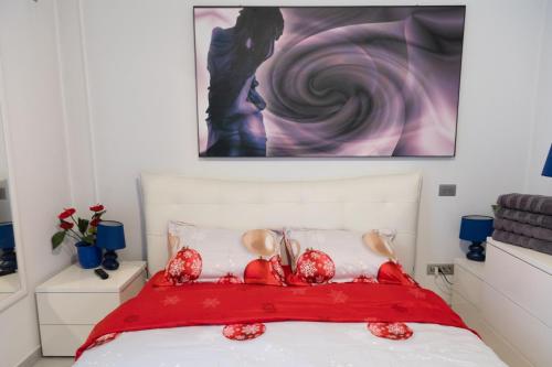 a bedroom with a bed with a red blanket at Blue light ultracentral in Craiova
