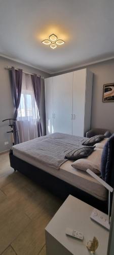 a bedroom with a large bed with a ceiling at Casa Mirka App 15 in Sal Rei