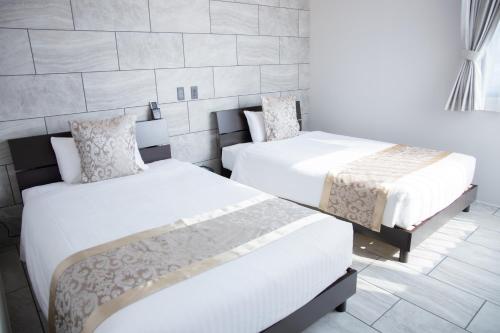 Postel nebo postele na pokoji v ubytování Sarah Resort Villa 海