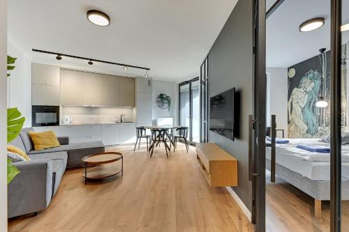 Televízia a/alebo spoločenská miestnosť v ubytovaní Apartamenty Portova Q4Apartments