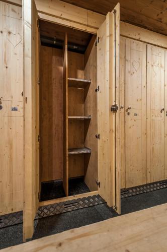 a room with wooden walls and stairs in a sauna at Val Thorens - Cosy Duplex avec Vue Pied des pistes Silveralp 570 in Val Thorens