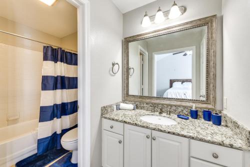 a bathroom with a sink and a mirror at Baton Rouge Condo with Balcony, Fireplace and Pool! in Baton Rouge