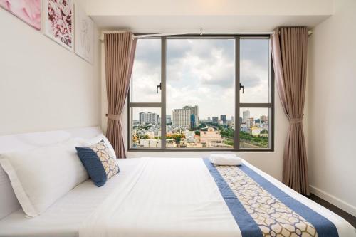 Postel nebo postele na pokoji v ubytování Goby home in Rivergate Luxury Apartment - near Ben Thanh market
