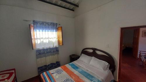 Postel nebo postele na pokoji v ubytování Hostal posada San jose
