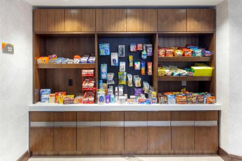 a store counter with food and other items on it at GLō Best Western Mississauga Corporate Centre in Mississauga
